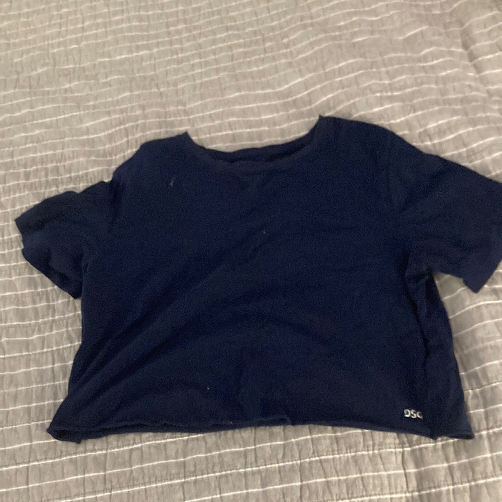 This is a dark blue cropped shirt
